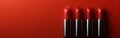 Four Red Lipsticks on Red Background Royalty Free Stock Photo