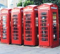 Four red phones booths. Royalty Free Stock Photo