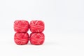 Four red sewing threads as wallpaper or background Royalty Free Stock Photo