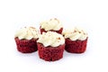 Four Red Velvet Iced Cupcakes on a white background Royalty Free Stock Photo