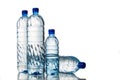 Four refreshing mineral water in plastic bottle in white background Royalty Free Stock Photo