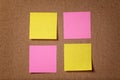 Four reminder sticky notes on cork board