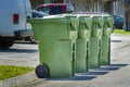 Four Residential Garbage Containers On The Street For Pickup Royalty Free Stock Photo