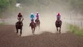 Four riders on horse races. Slow motion