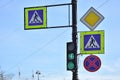 Four road signs and green traffic lightagainst blue background, Saint-Petersburg, Russia Royalty Free Stock Photo