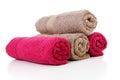 Four rolled colorful towels in red and brown Royalty Free Stock Photo