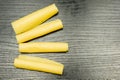 Four rolls of yellow cheese. Royalty Free Stock Photo