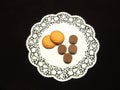Chocolates and cookies on white dolly paper