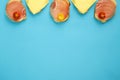 Four sandwiches with ham and cheese on a blue background.copy place Royalty Free Stock Photo