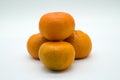 Four Satsuma Oranges on a White background