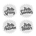 Four seasons stickers set. Hello Winter, Spring, Summer, Autumn lettering Royalty Free Stock Photo