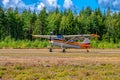Four-seat light all-metal single-engined piston-powered airplane Cessna 170B OH-CWQ landing on Karhula aviation museum airshow.