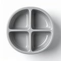 Four Sectioned Round Gray Plastic Dish on White Background Top View Royalty Free Stock Photo