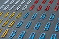 Four sections of rows of many red, yellow, white and blue colors paper clips for office work or education lies on dark scratched c