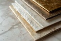 four sets of folded papers on marble, in the style of shimmering metallics Royalty Free Stock Photo