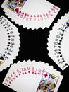 Four sets of poker playing cards closeup.