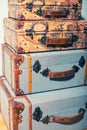A vertical pile of beautiful vintage suitcases Royalty Free Stock Photo