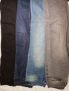Four shades of denim jeans pant grey blue light blue and black cloth photography