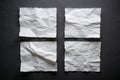 Four sheets of white torn paper on a black wall Royalty Free Stock Photo