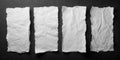 Four sheets of white torn paper on a black wall Royalty Free Stock Photo