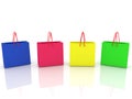 Four shopping bags of different colors on a white Royalty Free Stock Photo