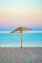 A four-sided umbrella from the sun on the beach made of natural materials Royalty Free Stock Photo