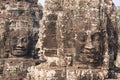 Four sides stone faces of Bayon temple in Angkor Royalty Free Stock Photo