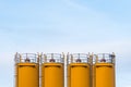 Four silos in front of blue sky Royalty Free Stock Photo