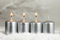 Four Advent candles. Three candles burning Royalty Free Stock Photo