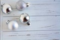 Four Silver Christmas Balls on White Background