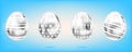 Four silver eggs on the sky blue background. Isolated objects for Easter. Cross, dots and stripes ornate Royalty Free Stock Photo