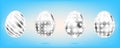 Four silver eggs on the sky blue background. Isolated objects for Easter. Cross, dots, stripes and stars Royalty Free Stock Photo
