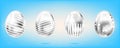 Four silver eggs on the sky blue background. Isolated objects for Easter. Dots and stripes ornate Royalty Free Stock Photo