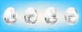 Four silver eggs on the sky blue background. Isolated objects for Easter. Stripes and dots ornate Royalty Free Stock Photo