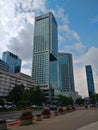 Four skyscrapers in the Warsaw city center seen front the street underneath