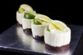 Four small cakes decorated with lime wedges Royalty Free Stock Photo