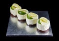 Four small cakes decorated with lime wedges Royalty Free Stock Photo