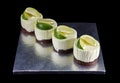 Four small cakes decorated with lime wedges Royalty Free Stock Photo