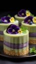 Four small cakes with flowers on top of them