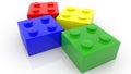 Four small colorful toy bricks on white