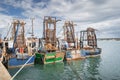 Four small fishing boats with shellfish cages moored in Howth harbour, Dublin, Ireland Royalty Free Stock Photo
