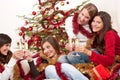 Four smiling women on Christmas