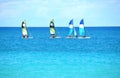 Four snorkeling catamaran boats on the open sea