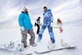 Four snowboard riders on hill