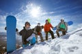 Four snowboarders at ski slope Royalty Free Stock Photo