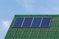 Four solar panels are installed on the roof slope of the house Royalty Free Stock Photo