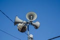 four speakers on the top of a pole Royalty Free Stock Photo