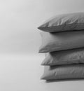 Four stacked cushions against the white background. Gray pillows on the white background