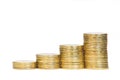 Four stacks of golden coins on white background.