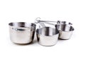 Four stainless steel measuring cups clipped together Royalty Free Stock Photo